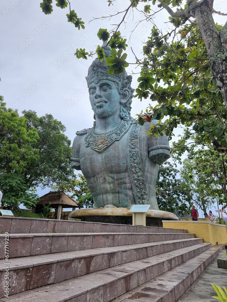 Vertical shot of a giant statue of Vishnu in the Garuda Wisnu Kencana Cultural Park in Bali. Vertical shot of a giant statue of Vishnu in the Garuda Wisnu Kencana Cultural Park in Bali.