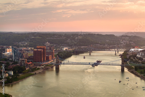 Covington Kentucky. Evening urban landscape of downtown district in USA. Skyline with bridge traffic and brightly illuminated high skyscraper buildings in modern American city photo