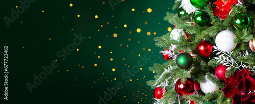 Christmas tree with ornaments  balls and lights on dark green background.