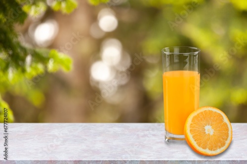 Fresh sweet orange juice in glass on table