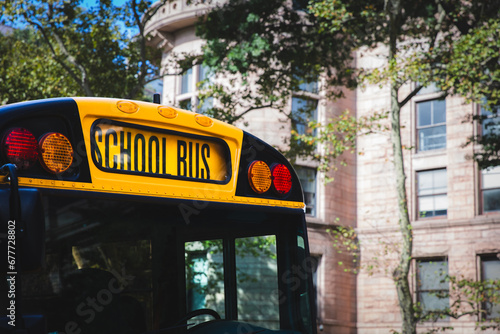 Close up of the front sign and lights of a typical American yellow school bus