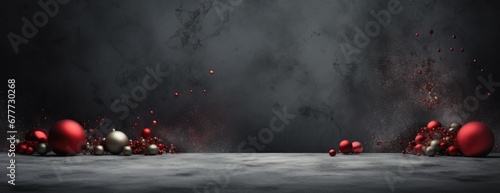  a group of red and silver balls floating in the air next to a black and white wall with a dark background.
