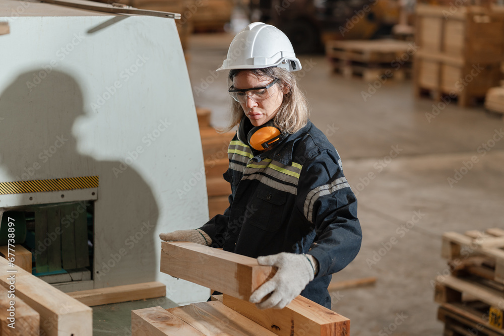 Caucasian business or technician craft woman working with machine and timber at wood factory	