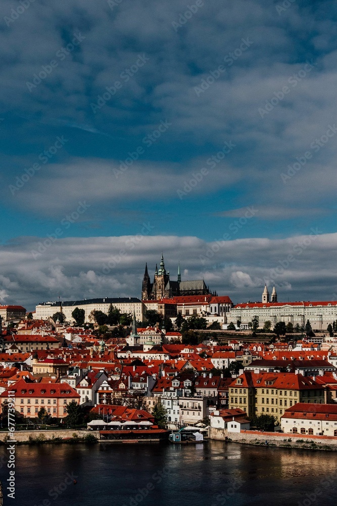 Obraz premium Vertical aerial view of a sunset sky over the skyline of Prague, Czech Republic