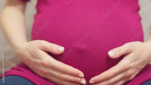 Wallpaper Mural Belly of a pregnant woman. Waiting for a child. The concept of pregnancy, motherhood, preparation and expectation. Torontodigital.ca