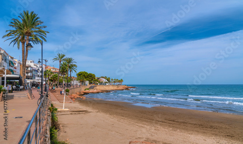 Alcossebre beach Spain Costa del Azahar with palm trees, beach and seafront © acceleratorhams