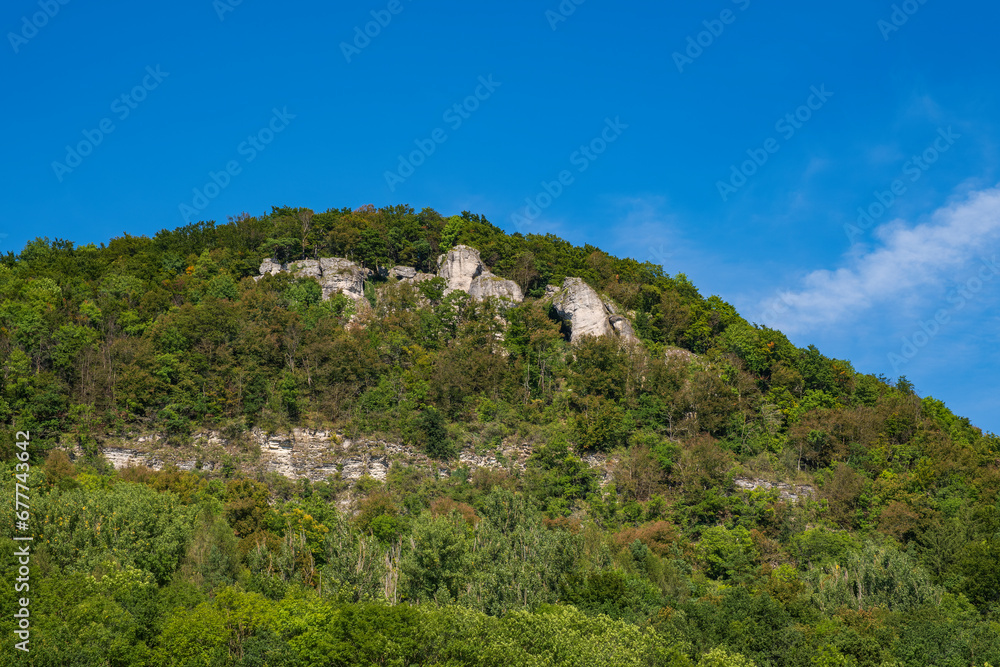 View up to the summit of Houbirg near Happurg/Germany with its rock formations