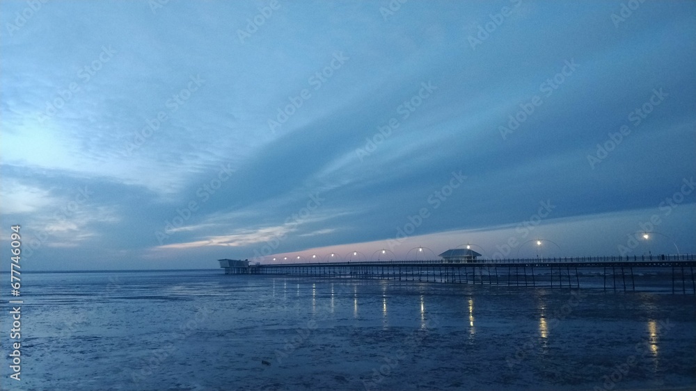 Scenic view of the Southern Pier in Merseyside, England during sunset