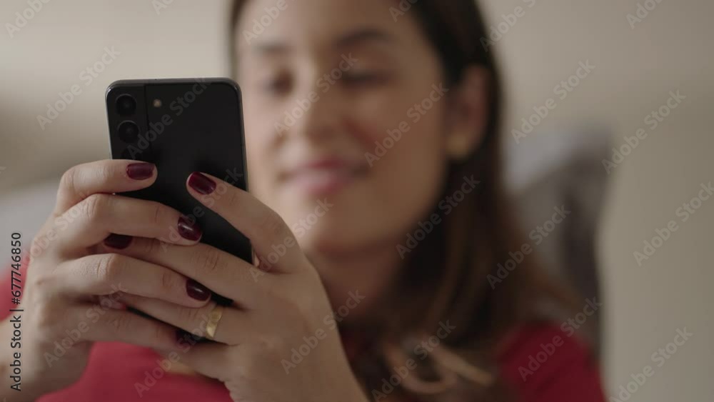 Happy woman holding cell phone using smartphone device at home. Smiling young woman blogger subscribing new social media, buying in internet, ordering products online in apps.
Happy woman holding cell phone using smartphone device at home. Smiling young woman blogger subscribing new social media, buying in internet, ordering products online in apps.