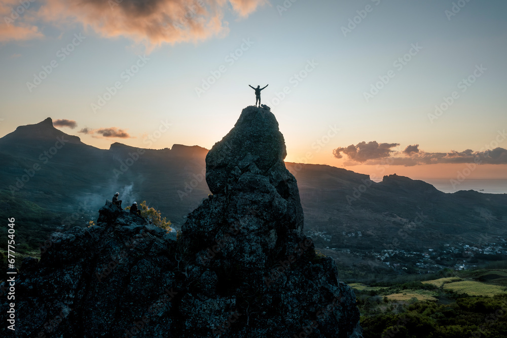 Aerial view of people climbing on Piton Jacob Peak mountain in Port