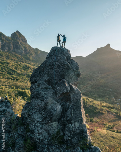 Aerial view of people climbing on Piton Jacob Peak mountain in Port Louis, Mauritius.