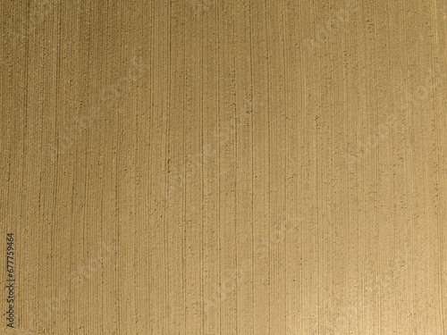 Aerial view of wheat field on countryside farmland.