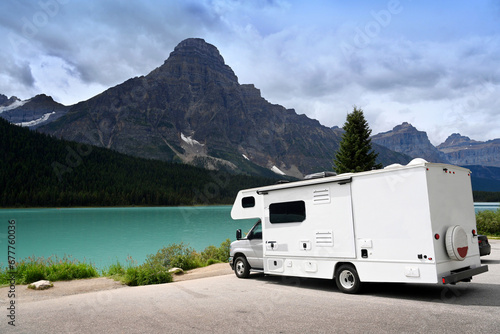 trailer by the lake. trip to the mountains. travel concept. trip by own transport or rented trailer.