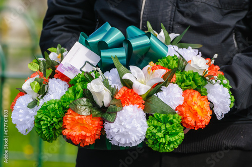 Youth holds Republican Wreath from Fianna hEreann (Soldiers of Ireland) photo