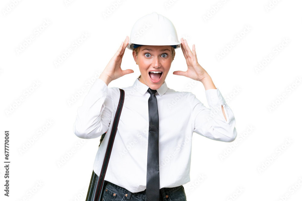 Young architect caucasian woman with helmet and holding blueprints over isolated background with surprise expression Young architect caucasian woman with helmet and holding blueprints over isolated background with surprise expression