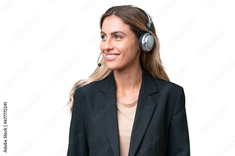 Telemarketer pretty Uruguayan woman working with a headset over isolated background looking side Telemarketer pretty Uruguayan woman working with a headset over isolated background looking side