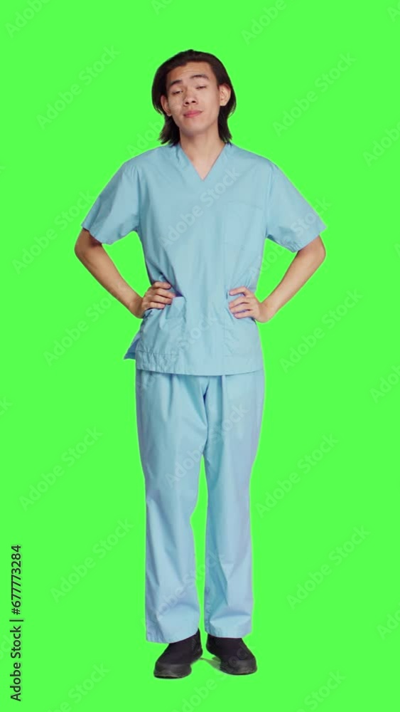 Front view of healthcare employee yawning on camera over full body greenscreen, feeling tired after difficult night shift. Asian nurse medical worker being sleepy and exhausted in studio, specialist. Front view of healthcare employee yawning on camera over full body greenscreen, feeling tired after difficult night shift. Asian nurse medical worker being sleepy and exhausted in studio, specialist.