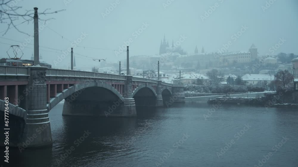 landscape in winter in Prague, Czech Republic with Vltava river, St. Vitus Cathedral and bridge in the evening. landscape in winter in Prague, Czech Republic with Vltava river, St. Vitus Cathedral and bridge in the evening.