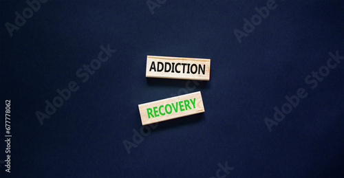Addiction recovery symbol. Concept words Addiction recovery on beautiful wooden blocks. Beautiful black table black background. Psychology addiction recovery concept. Copy space.