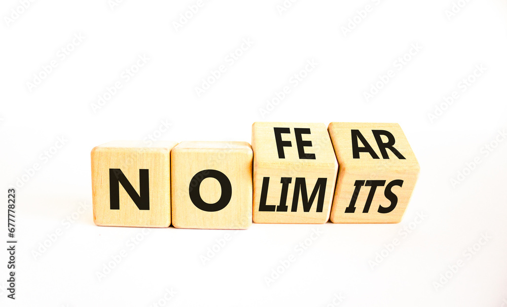 No fear and limits symbol. Concept words No fear No limits on wooden block. Beautiful white table white background. Business motivational no fear and limits concept. Copy space. No fear and limits symbol. Concept words No fear No limits on wooden block. Beautiful white table white background. Business motivational no fear and limits concept. Copy space.