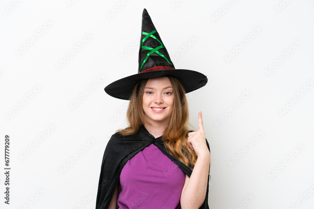 Young pretty woman costume as witch isolated on white background pointing with the index finger a great idea Young pretty woman costume as witch isolated on white background pointing with the index finger a great idea
