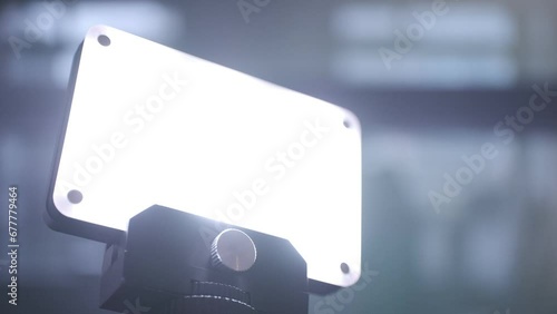Vlogging light being turned on, macro closeup of finger pushing the button, bright illumination for video, live streaming and zoom meetings