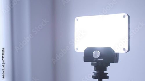 Vlogging light being turned on, macro closeup of finger pushing the button, bright illumination for video, live streaming and zoom meetings