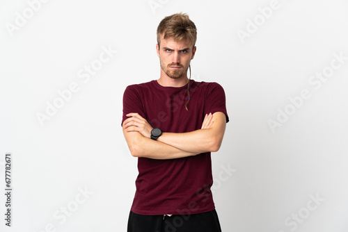 Young handsome man isolated on white background with unhappy expression