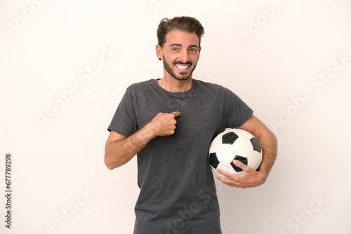 Young football player woman isolated on white background with surprise facial expression