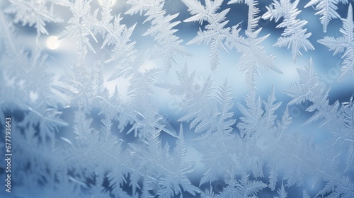  a close up of a frosted glass window with snow flakes on the outside and inside of the window. © Anna