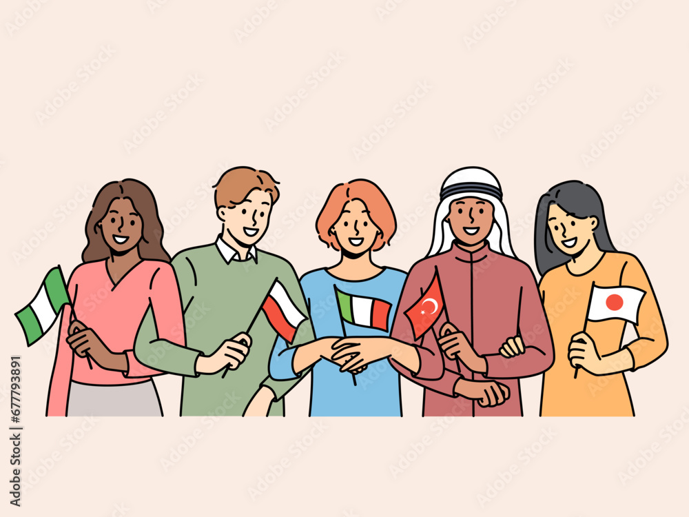 Students of different nationalities hold state flags and smile, inviting them to take part in educational exchange. Guys and girls students of international faculty of college or university Students of different nationalities hold state flags and smile, inviting them to take part in educational exchange. Guys and girls students of international faculty of college or university