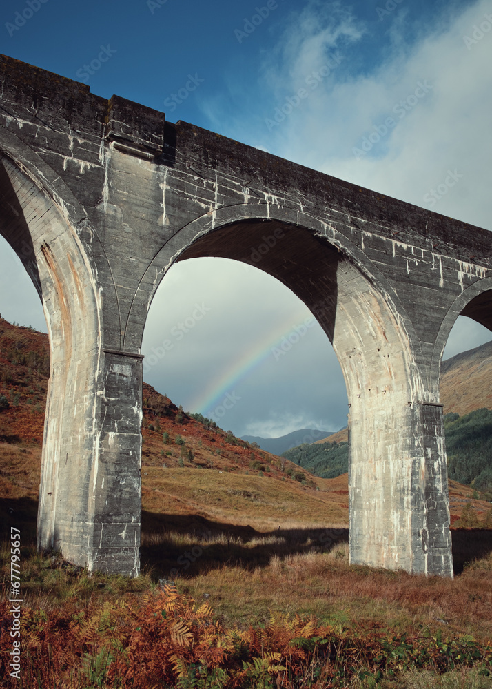 Scottish viaduct bridge in the autumn. Travel and tourist destination in Europe. Glenfinnan Viaduct, Highlands, Scotland, United Kingdom