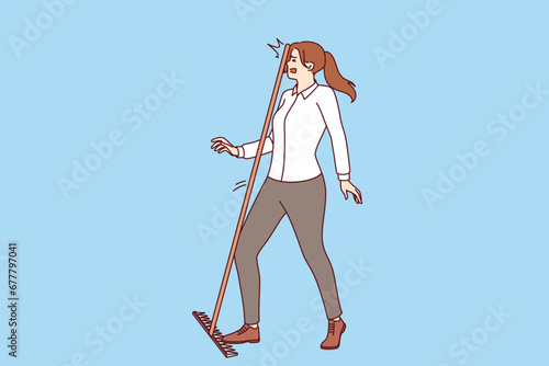 Business woman steps on rake and gets hit on head, demonstrating popular folk wisdom. Stupid girl manager gets injured walking on rake and not wanting to look at feet to avoid career failures