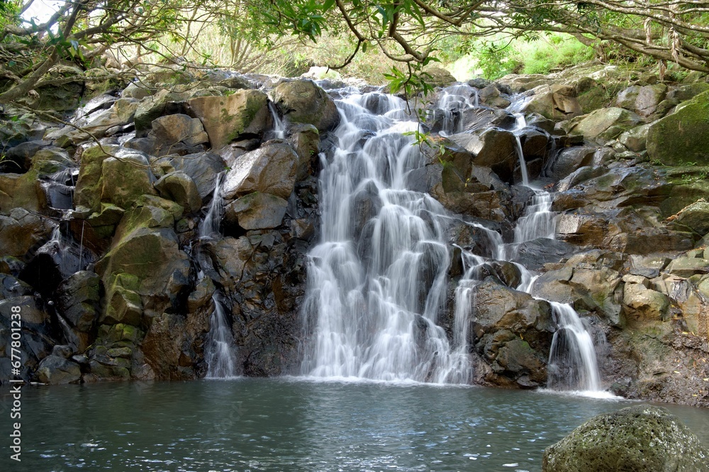 Beautiful view of a waterfall falling in the lake Beautiful view of a waterfall falling in the lake