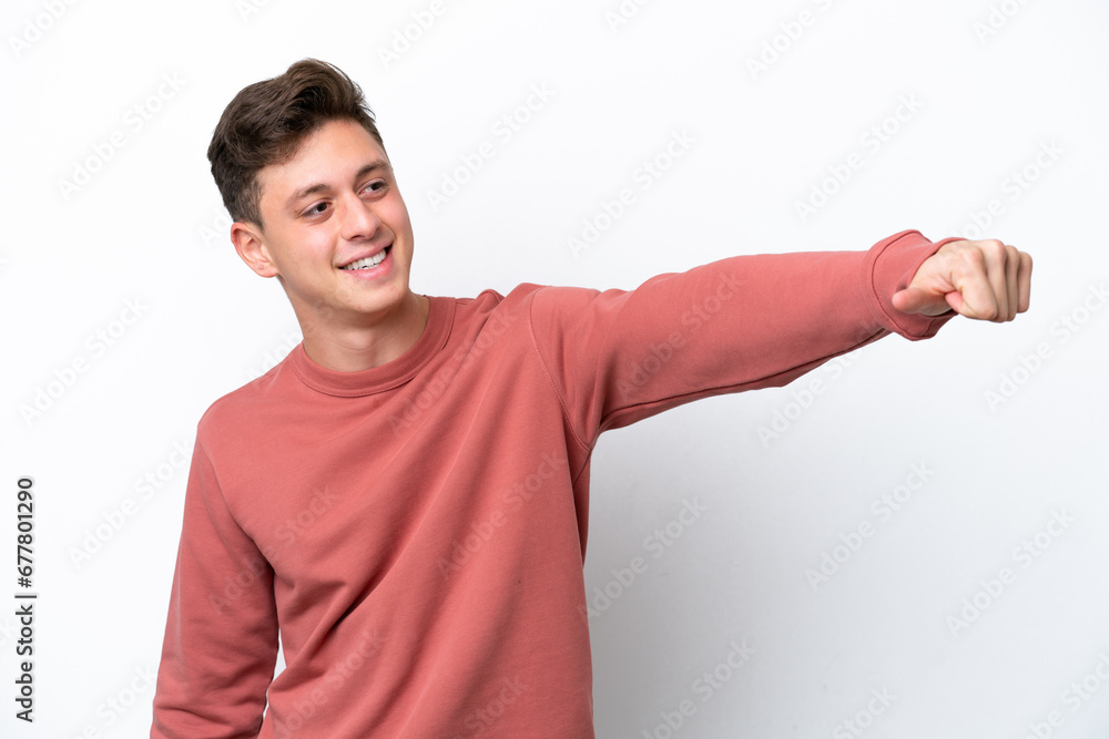 Young handsome Brazilian man isolated on white background giving a thumbs up gesture Young handsome Brazilian man isolated on white background giving a thumbs up gesture
