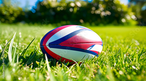 Sport. A modern rugby ball on the grass pitch.
