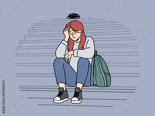 Teenage woman cries because of bullying or harassment and sits on steps suffering from social problems. Upset girl needs psychological support to overcome complexes caused by bullying in college