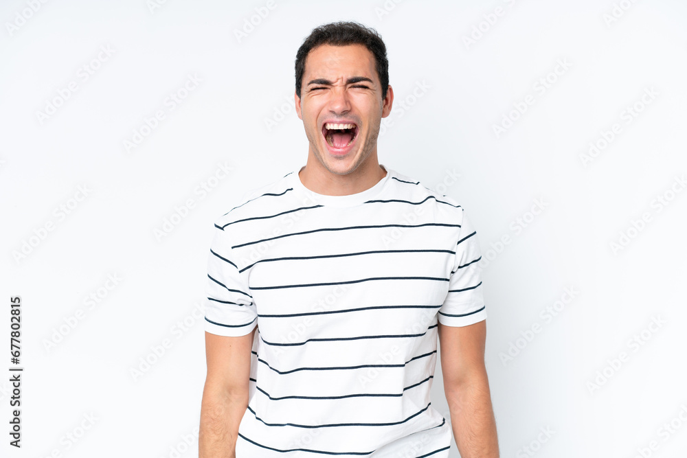 Young caucasian man isolated on white background shouting to the front with mouth wide open Young caucasian man isolated on white background shouting to the front with mouth wide open