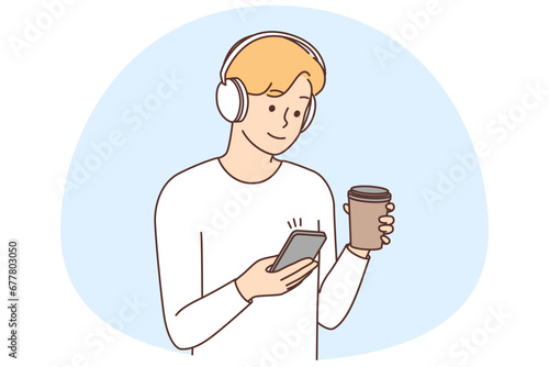 Man in headphones texting on smartphone