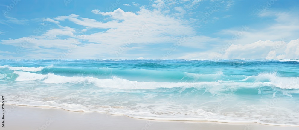 The abstract pattern of the background showcases the mesmerizing texture of the water while the vibrant blue sky blends seamlessly with the sandy beach creating a picturesque summer scene th The abstract pattern of the background showcases the mesmerizing texture of the water while the vibrant blue sky blends seamlessly with the sandy beach creating a picturesque summer scene th