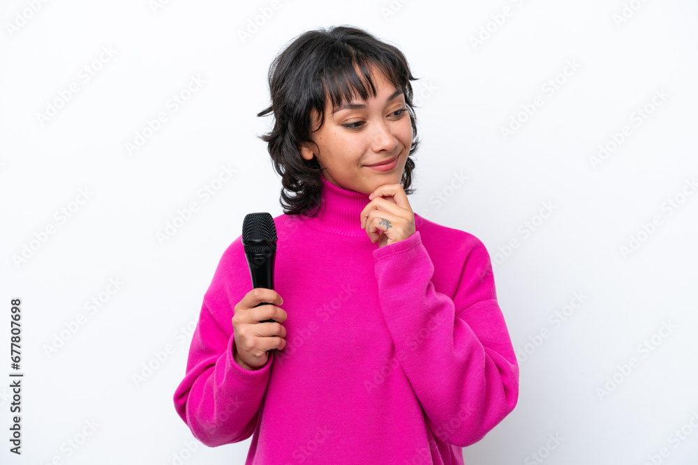 Young Argentinian singer woman isolated on white background looking to the side and smiling Young Argentinian singer woman isolated on white background looking to the side and smiling