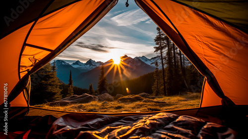 Sunrise view from inside a tent overlooking mountains.