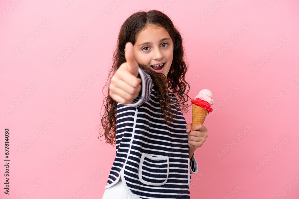 Little caucasian girl holding an ice cream isolated on pink background with thumbs up because something good has happened Little caucasian girl holding an ice cream isolated on pink background with thumbs up because something good has happened