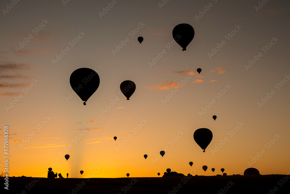 Air balloons at sunset over Cappadocia-Goreme, Turkey, Oct. 20th,2022. A vibrant explosion of light and color, and the enthusiasm of flying an air balloon over the strange rock formation.