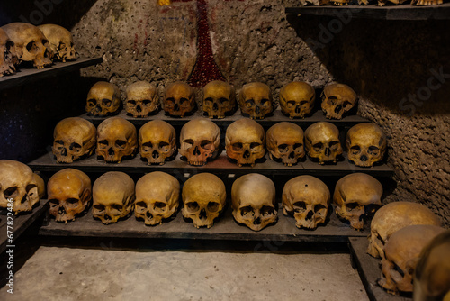 Bild auf Leinwand Human skulls in old crypt or catacombs