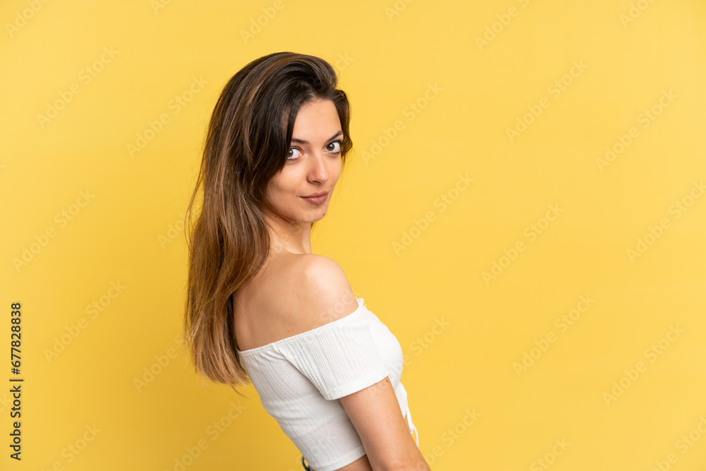 Young caucasian woman isolated on yellow background . Portrait Young caucasian woman isolated on yellow background . Portrait