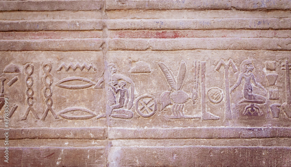 Ancient Egyptian Hieroglyph showing childbirth and motherhood. It is read from right to left..Egypt. Horizontally. Ancient Egyptian Hieroglyph showing childbirth and motherhood. It is read from right to left..Egypt. Horizontally.