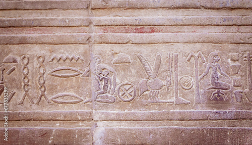 Ancient Egyptian Hieroglyph showing childbirth and motherhood. It is read from right to left..Egypt. Horizontally. 