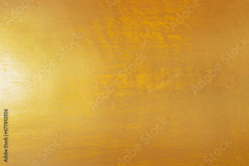 Gold texture background with yellow metallic foil luxury shiny shine glitter sparkle of bright light reflection on metal bronze golden surface