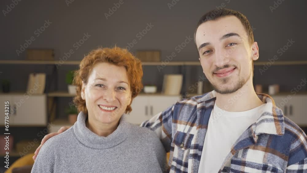 Mother and son smiling at the camera. Mother and son smiling at the camera.